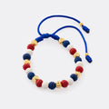 Guillo Bandera Dominicana azul, tejido a mano con balines de oro laminado 18k