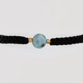 Guillo Larimar Negro, tejido a mano con balines de oro laminado 18k